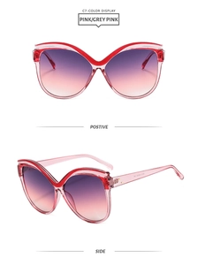 Détails de lunettes de soleil œil de chat rouges avec verres dégradés et marquage UV400