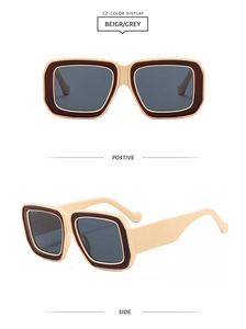 Détails de la monture contrastée beige et brun rouge avec verres gris de ces lunettes