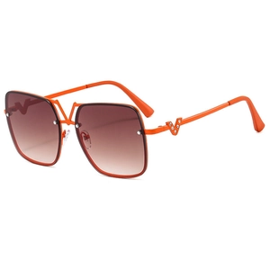 Orange square oversized sunglasses with gradient brown lenses and V-shaped crystal accents