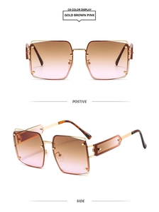 Detail view of gold geometric temples and brown gradient lenses on oversized sunglasses