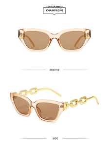 Detail of champagne cat eye sunglasses featuring unique gold metal chain link temples