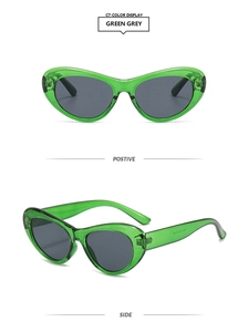 Détail des lunettes de soleil œil-de-chat vertes translucides à la mode