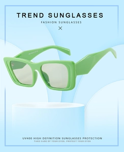 Detail view of green cat eye sunglasses featuring UV400 protection and 3062 model code