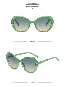 Close-up of green translucent cat-eye sunglasses with blue-brown gradient lenses