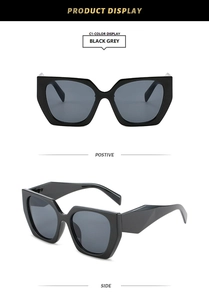 Oversized geometric black sunglasses with grey lenses shown in front and side views