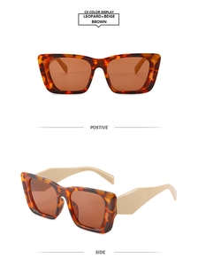 Close-up of retro cat-eye sunglasses featuring leopard print frames and beige temples