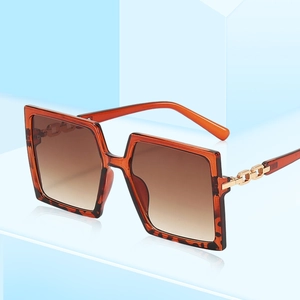 Fashionable oversized square tortoise shell sunglasses with gold chain metal temples