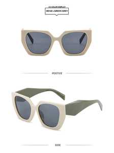 Detail of geometric oversized sunglasses in beige and olive green with a dual-tone design