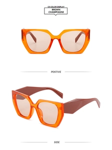 Detail view of large geometric sunglasses in transparent orange with dark brown temples