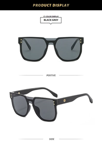Detailed front and side view of black square oversized sunglasses with gold rivets
