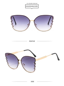 Detail of butterfly frame sunglasses with gold temples and purple gradient lenses