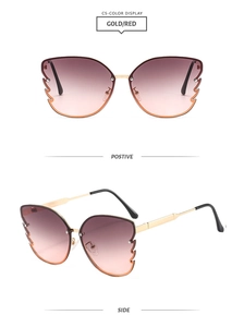Detailed view of butterfly metal frame sunglasses with gold finish and red gradient lenses
