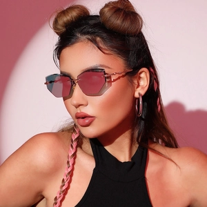 Chic rimless geometric sunglasses with pink gradient lenses and slim metal temples on model