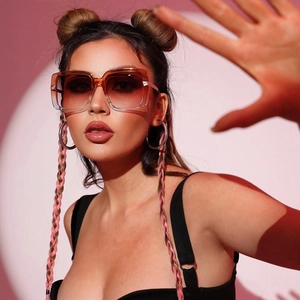 Fashionable oversized square sunglasses with brown gradient lenses and translucent frames