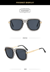 Detail view of square oversized sunglasses with transparent grey frames and gold metal temples