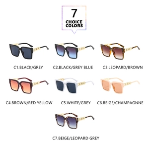 Flat lay of square oversized sunglasses with gold chain temples in seven trendy colors