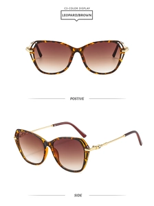 Cat eye leopard print sunglasses with gold metal temples and brown gradient lenses