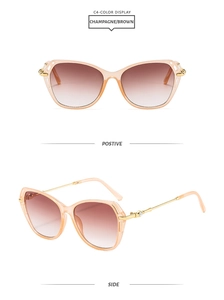 Detail view of champagne cat-eye sunglasses with rhinestone metal temples and gradient lens