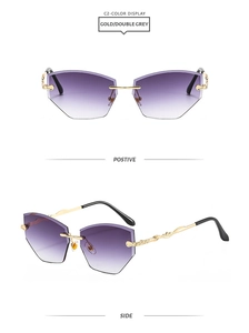 Detail of rimless sunglasses featuring geometric diamond-cut lenses and gold metal temples