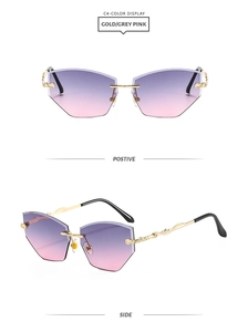 Close-up of frameless gradient lenses and intricate vine pattern on gold metal temples