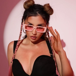 Fashionable pink square frame sunglasses with tinted lenses for a trendy street look