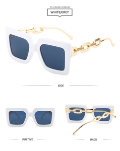 Detailed views of white square sunglasses with bold gold chain temples and grey lenses