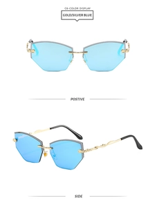 Detail of rimless blue diamond cut sunglasses with vintage engraved golden temples