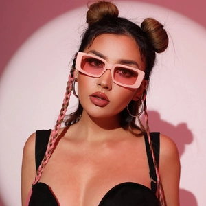 Chic pink square sunglasses for women with matching tinted lenses on a fashion model