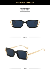 Detail view of square black sunglasses with premium gold metal temples and grey lenses