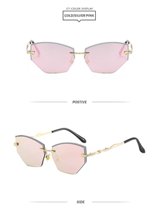 Detail view of rimless diamond cut sunglasses in gold-pink with metal engraved temples