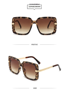 Detail of leopard print square sunglasses with gradient brown lenses and gold metal accents