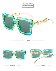 Detail of square green stripe resin sunglasses with thick gold metal chain temples