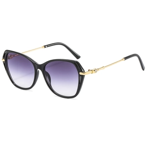 Fashionable cat eye sunglasses with purple gradient lenses and gold metal temples