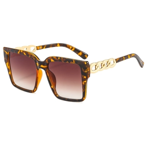 Chic oversized square tortoiseshell sunglasses featuring golden chain temples and brown lenses