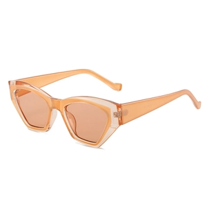Fashionable cat eye sunglasses with translucent orange frames and tinted lenses