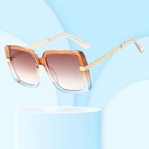 Modern oversized square sunglasses with gradient frames and textured gold metal temples