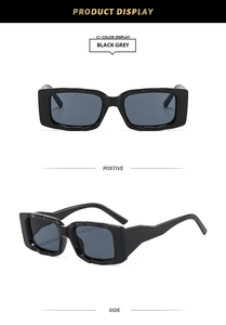 Detail view of stylish black square frame sunglasses with grey lenses in dual angles