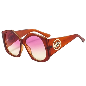 Lunettes de soleil géométriques ambre avec verres dégradés et décorations dorées