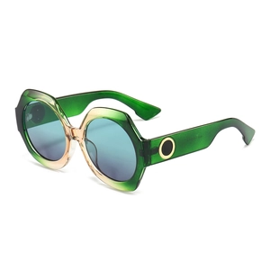 Lunettes de soleil rondes oversize à monture verte et verres dégradés bleus