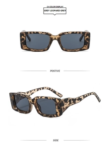 Detail view of rectangular leopard print sunglasses with thick temples and dark grey lenses