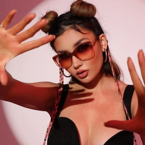 Fashionable cat-eye sunglasses with brown gradient lenses and light brown translucent frame