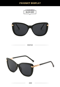 Detailed views of cat eye sunglasses in black grey with gold metal temple accents