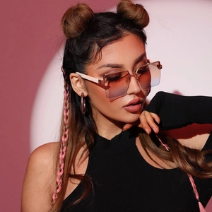 Fashionable rimless square sunglasses with orange-blue gradient lenses and beige temples