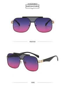 Detail view of large square black and gold sunglasses with blue purple gradient lenses