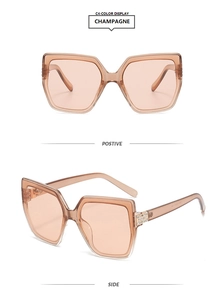 Detail of champagne square sunglasses featuring sparkling rhinestone hinges and tinted lenses