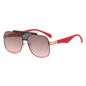 Modern oversized semi-rimless sunglasses with pink gradient lenses and bold red temples