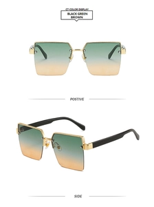 Detail view of square half-rim sunglasses with gold metal frame and gradient lenses