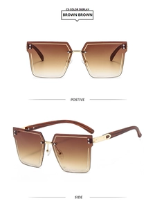 Detail of rimless square brown gradient sunglasses with gold C-hinge and textured temples