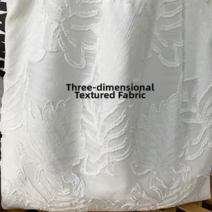 Detailed macro view of 3D leaf-textured white jacquard fabric for simple canvas tote bags