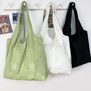 Three minimalist textured leaf tote bags in green, white and black colors for summer